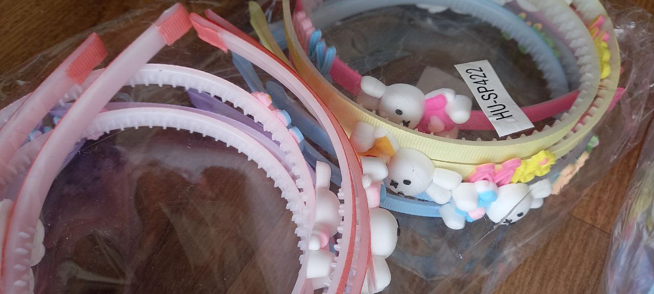 Cintillo plástico niña (paq con 12)